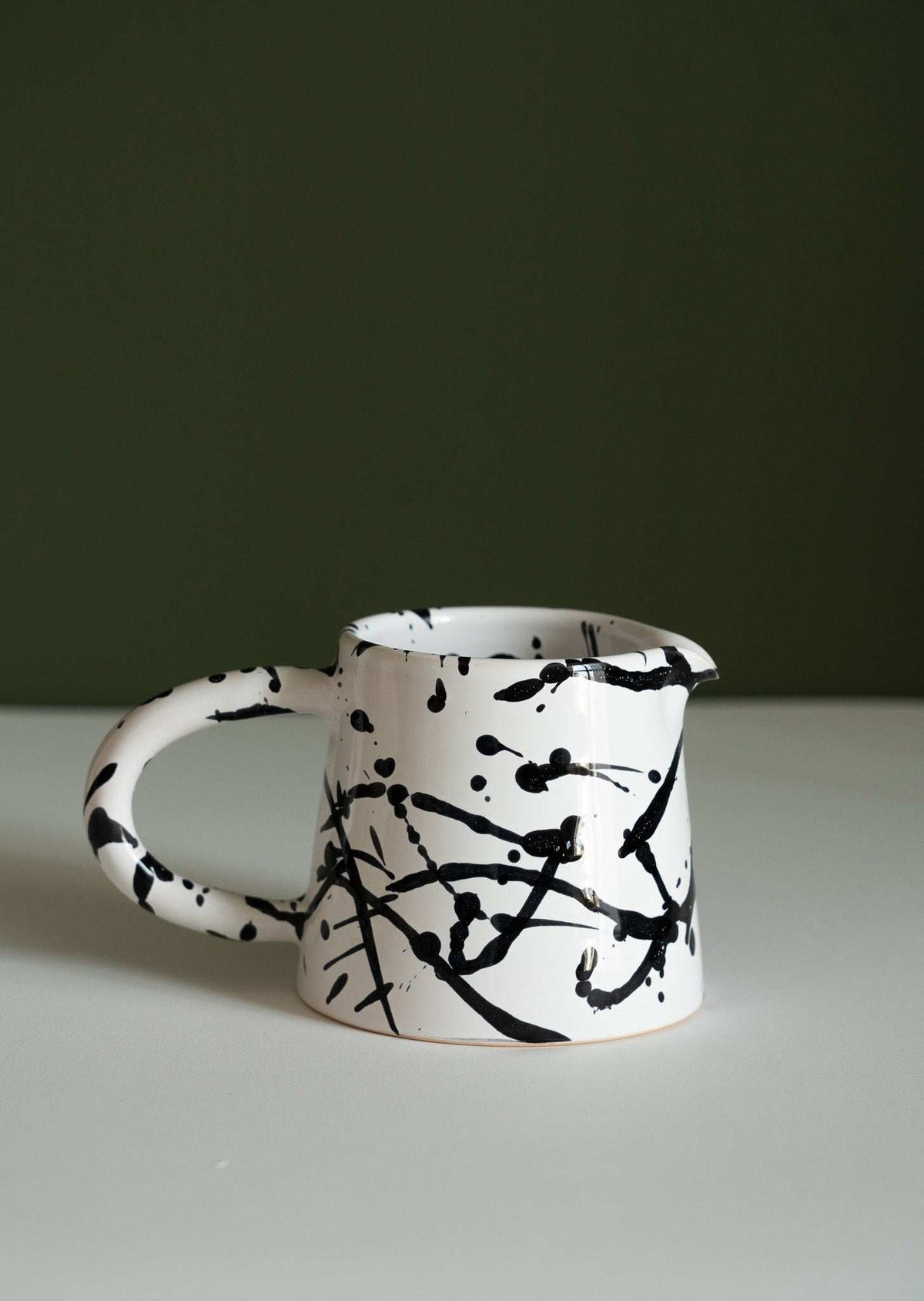 Handmade ceramic pour over coffee set with stoneware dripper and pitcher in monochrome finishes