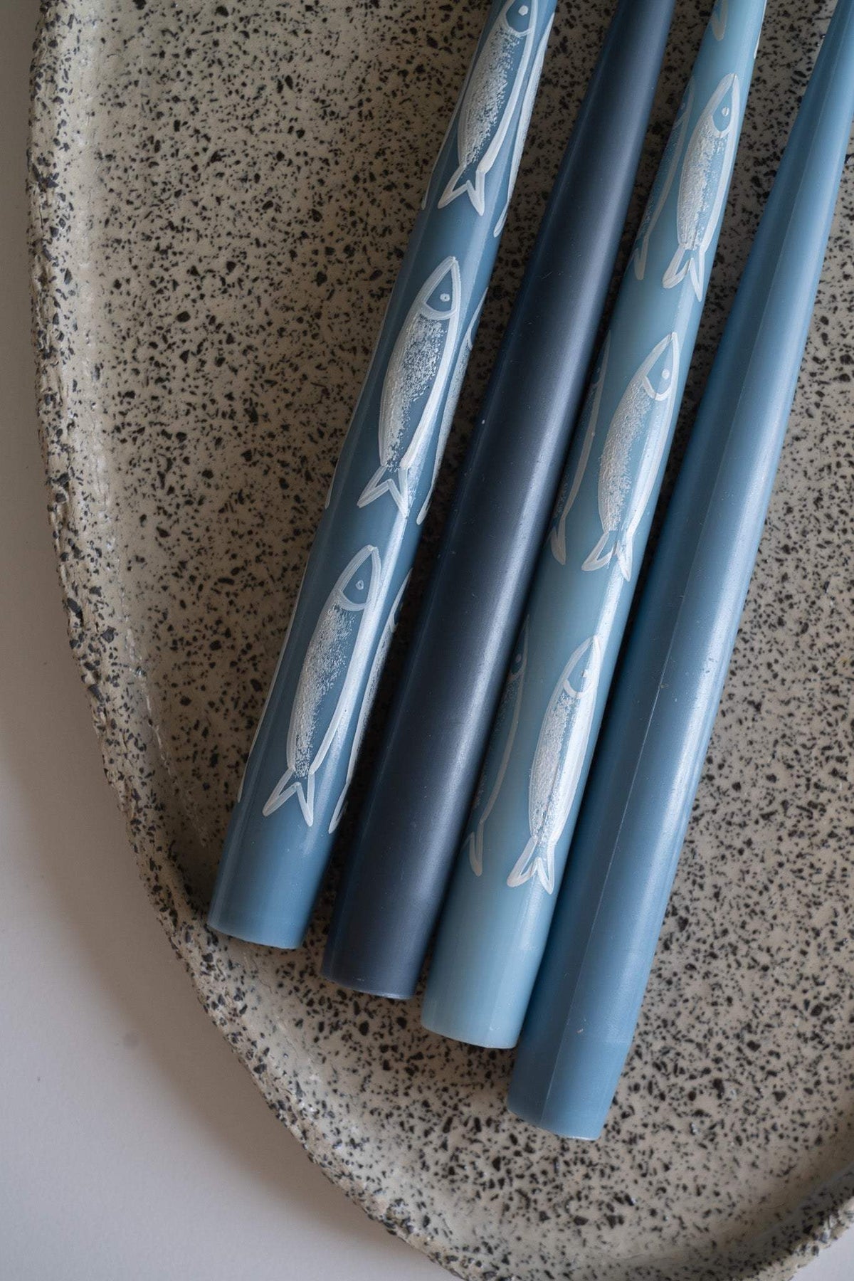 Hand-painted taper candle set with blue sardine illustrations in coastal style