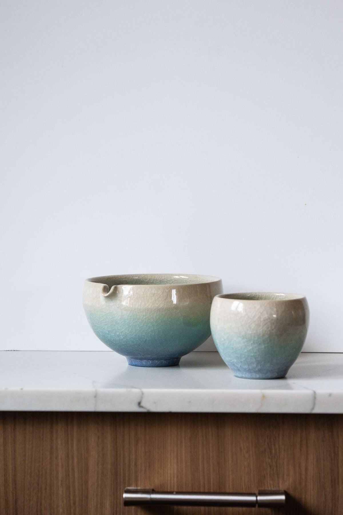 Ceramic Matcha Bowl set in cream and aqua glazed stoneware, with a pour spout and matching cup in a subtle gradient.