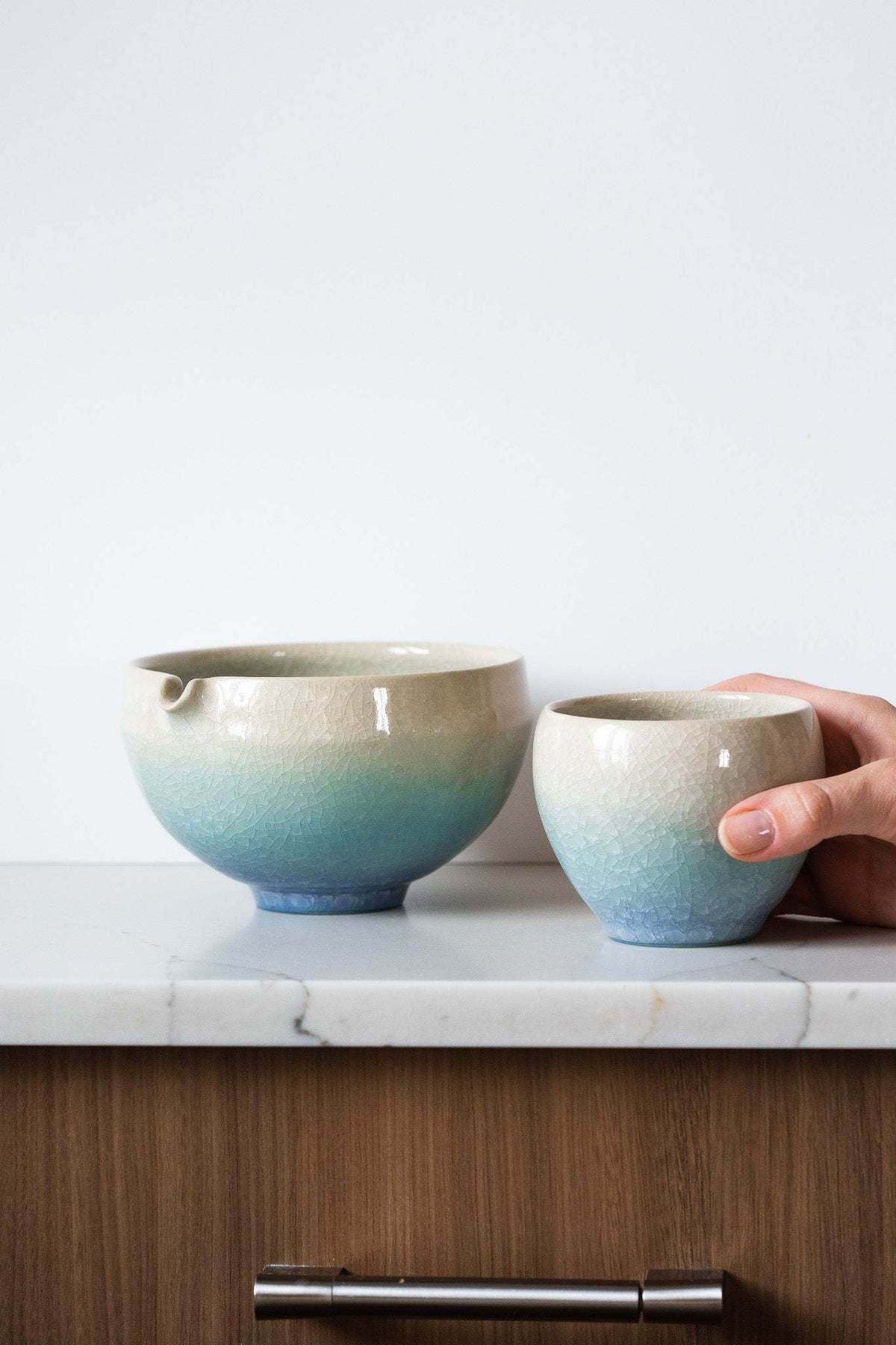 Ceramic Matcha Bowl and matching cup set in cream-to-aqua gradient stoneware, with crackle glaze and pouring spout.
