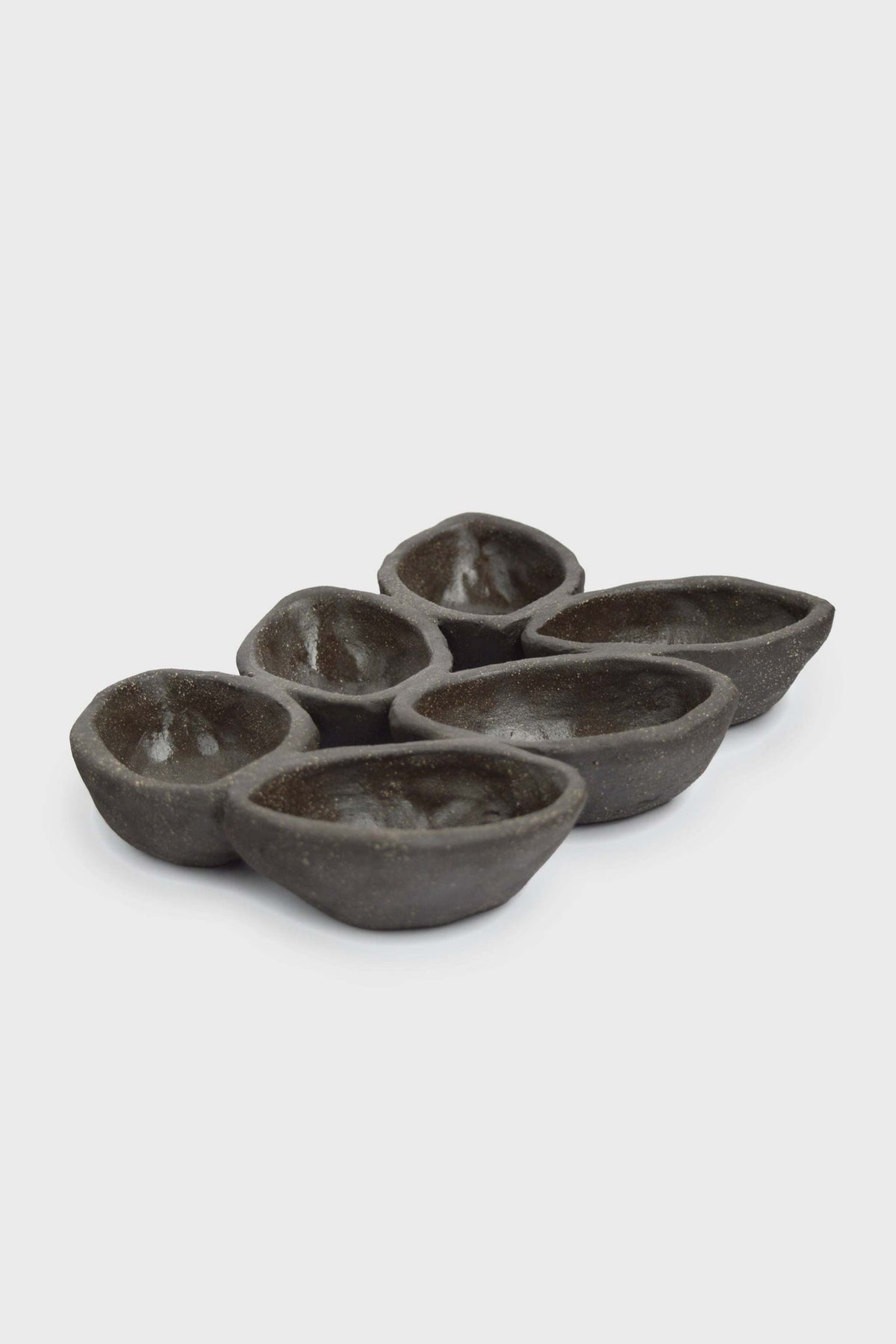 Stoneware Serving Dish in deep earthy brown-gray, with a handmade spiked form and six glazed serving wells.
