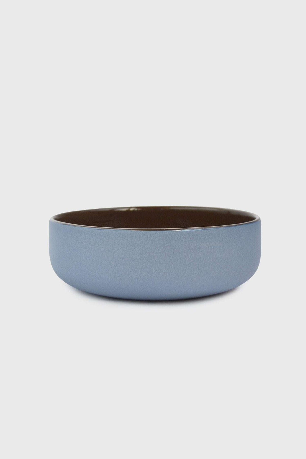 Handmade porcelain bowl with forget-me-not blue exterior and chocolate brown interior glaze