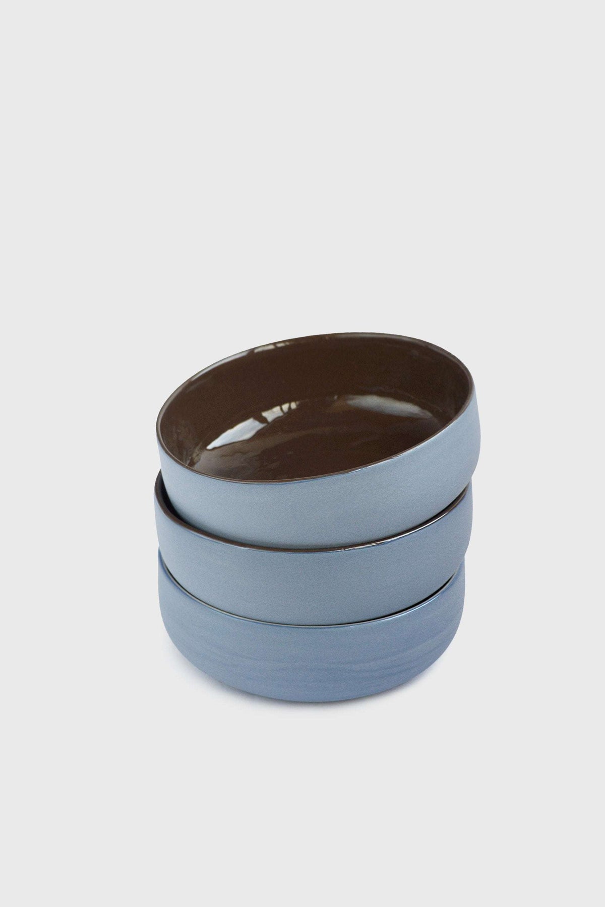 Handmade porcelain bowl with forget-me-not exterior and chocolate interior glaze