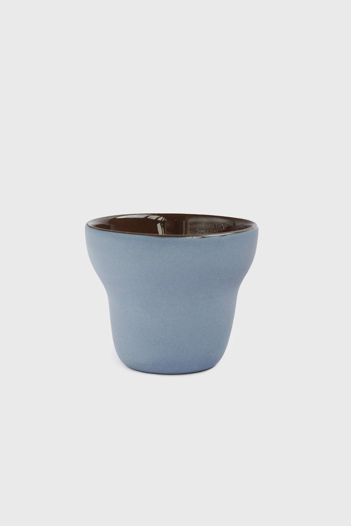 Handmade pear-shaped porcelain coffee cup with forget-me-not exterior and chocolate interior glaze