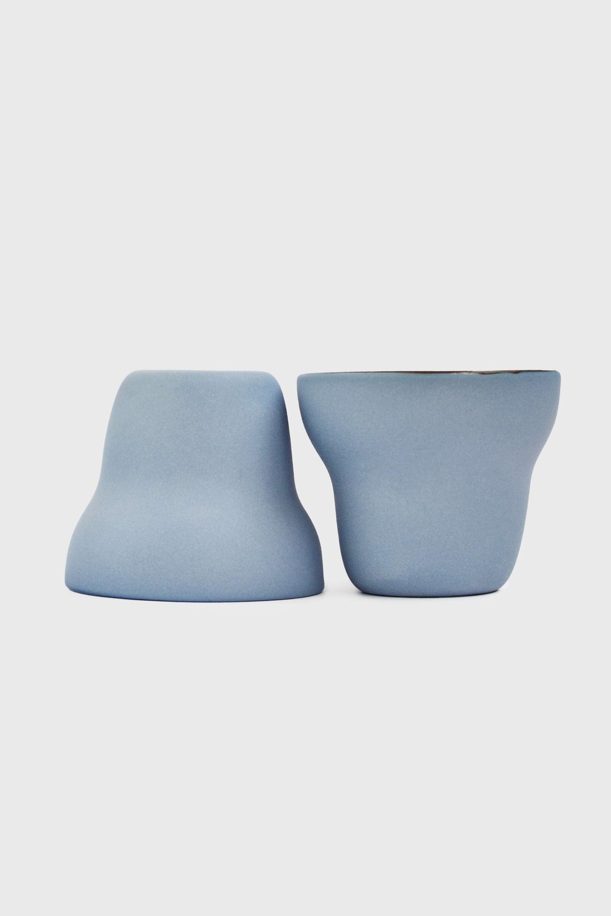 Pear-shaped handmade porcelain coffee cup with forget-me-not exterior and chocolate interior glaze