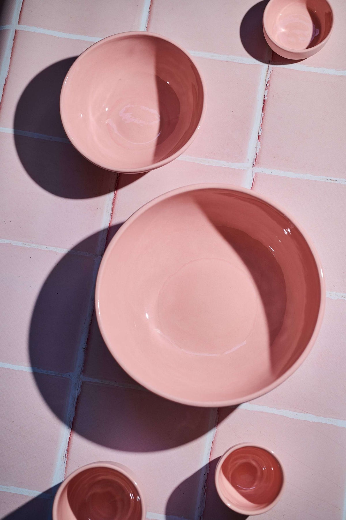 Handmade porcelain bowl in powder pink with shiny glaze and smooth finish
