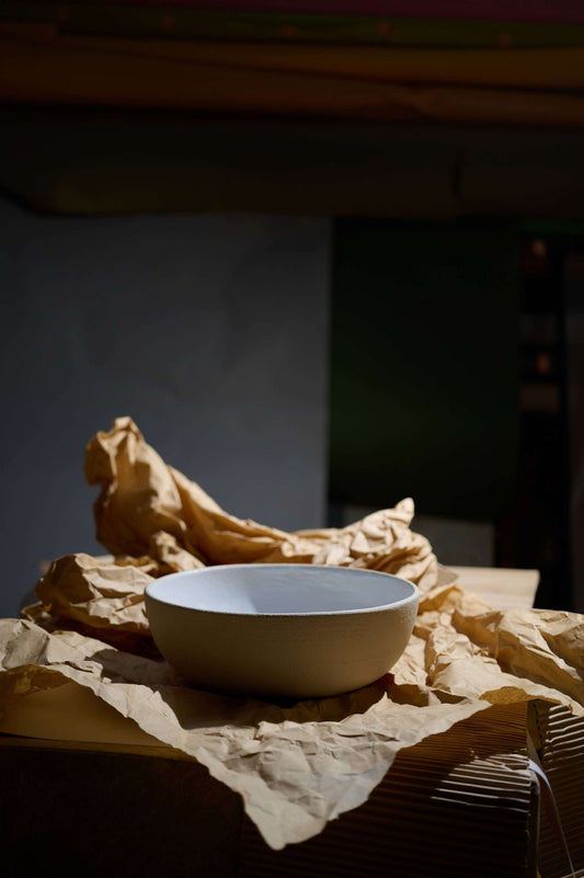 Handmade stoneware large fruit bowl with white glazed interior, rustic texture, and food-safe finish