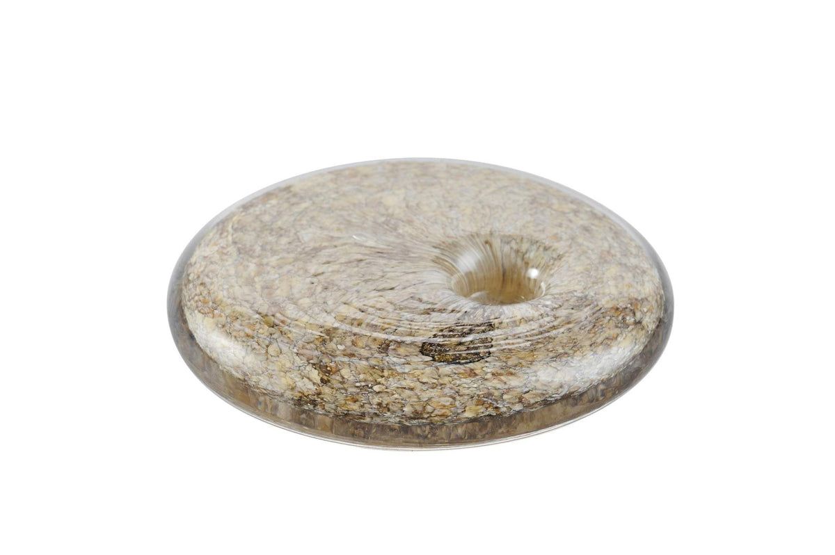 Hand blown glass marble-inspired candle holder with rounded shape and unique imperfections
