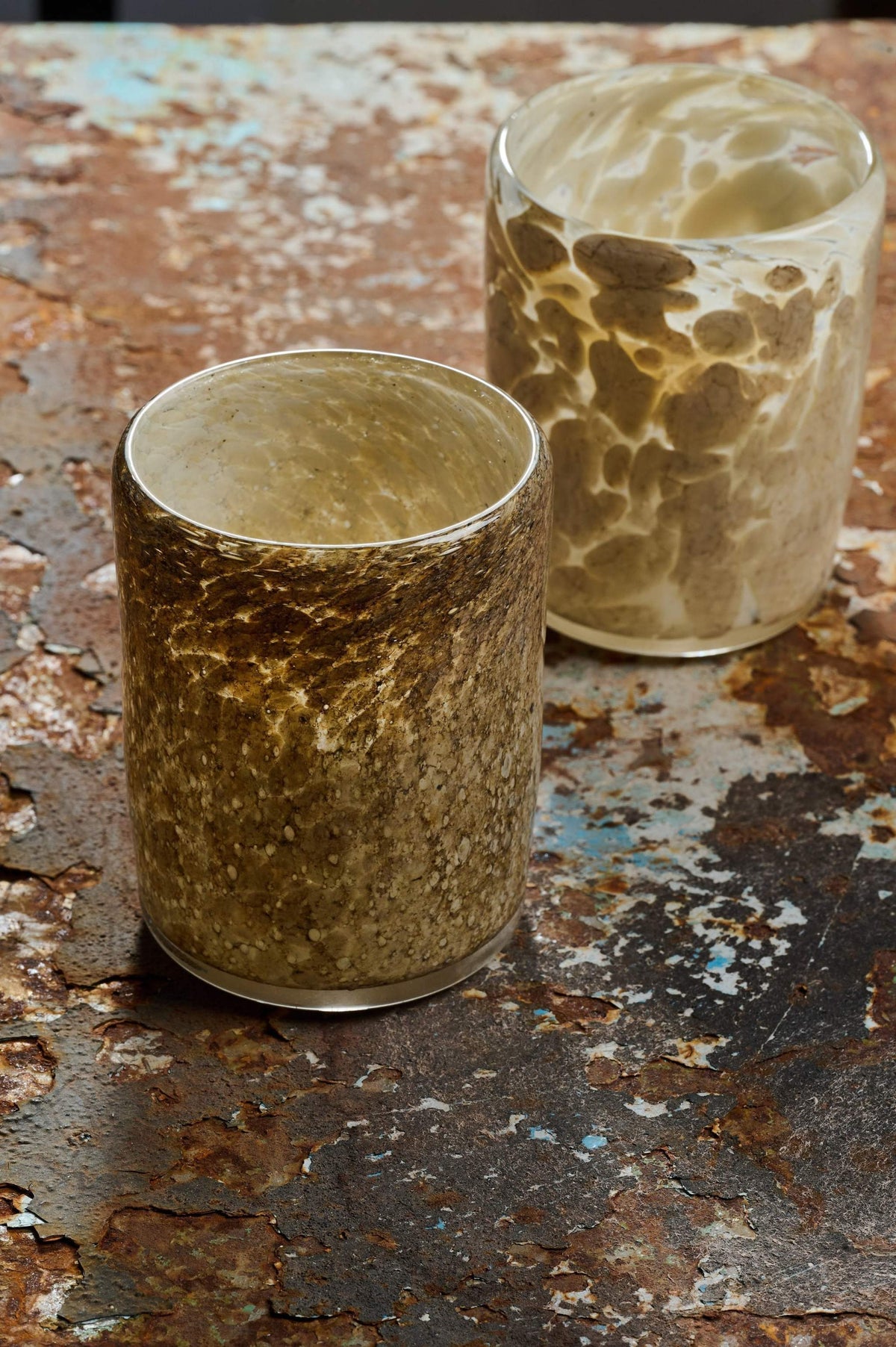Hand blown glass tumbler with marble-inspired pattern and unique shape from Ukraine