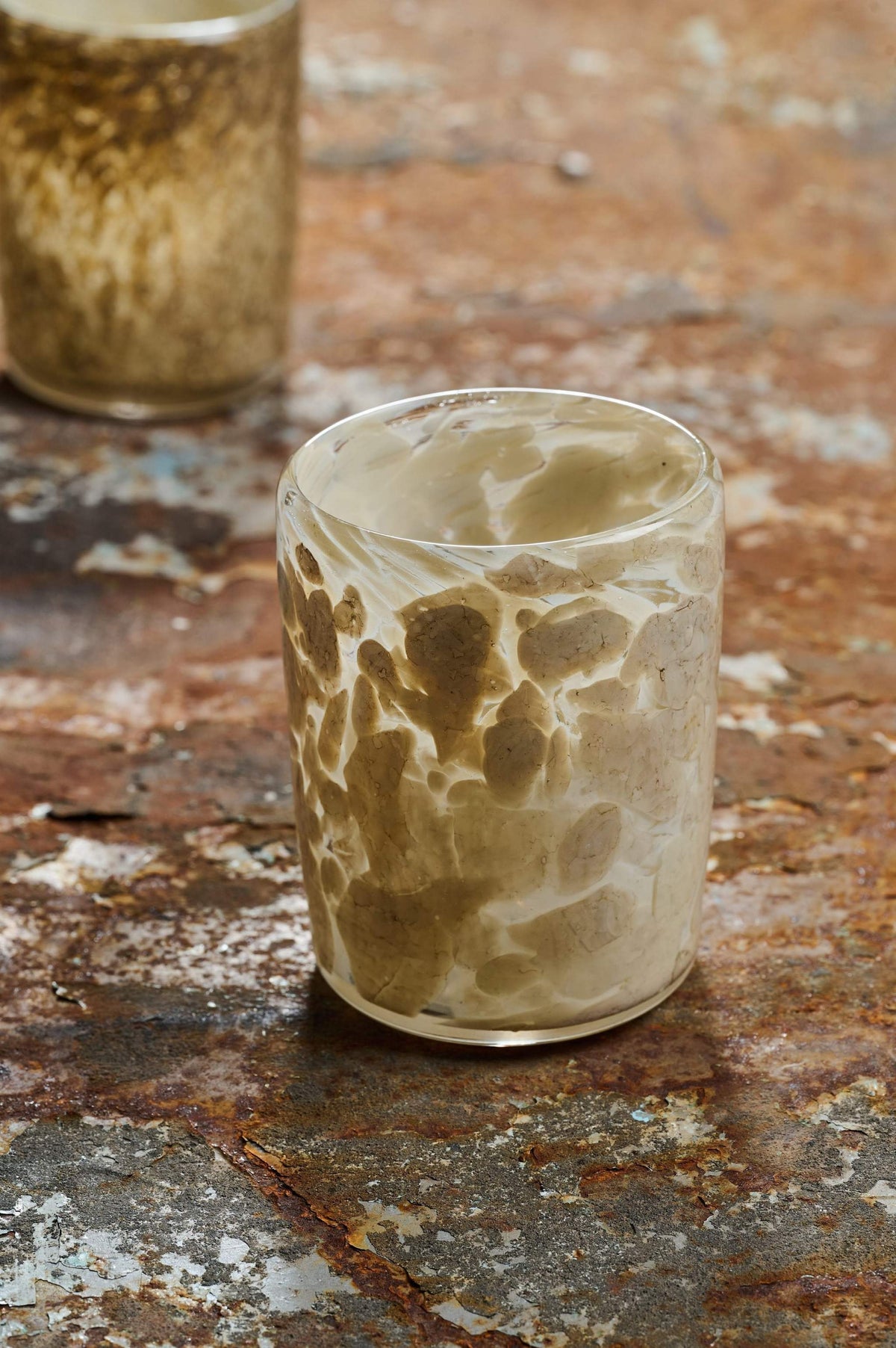 Hand blown glass tumbler with unique marble pattern and straight edges, handmade in Ukraine