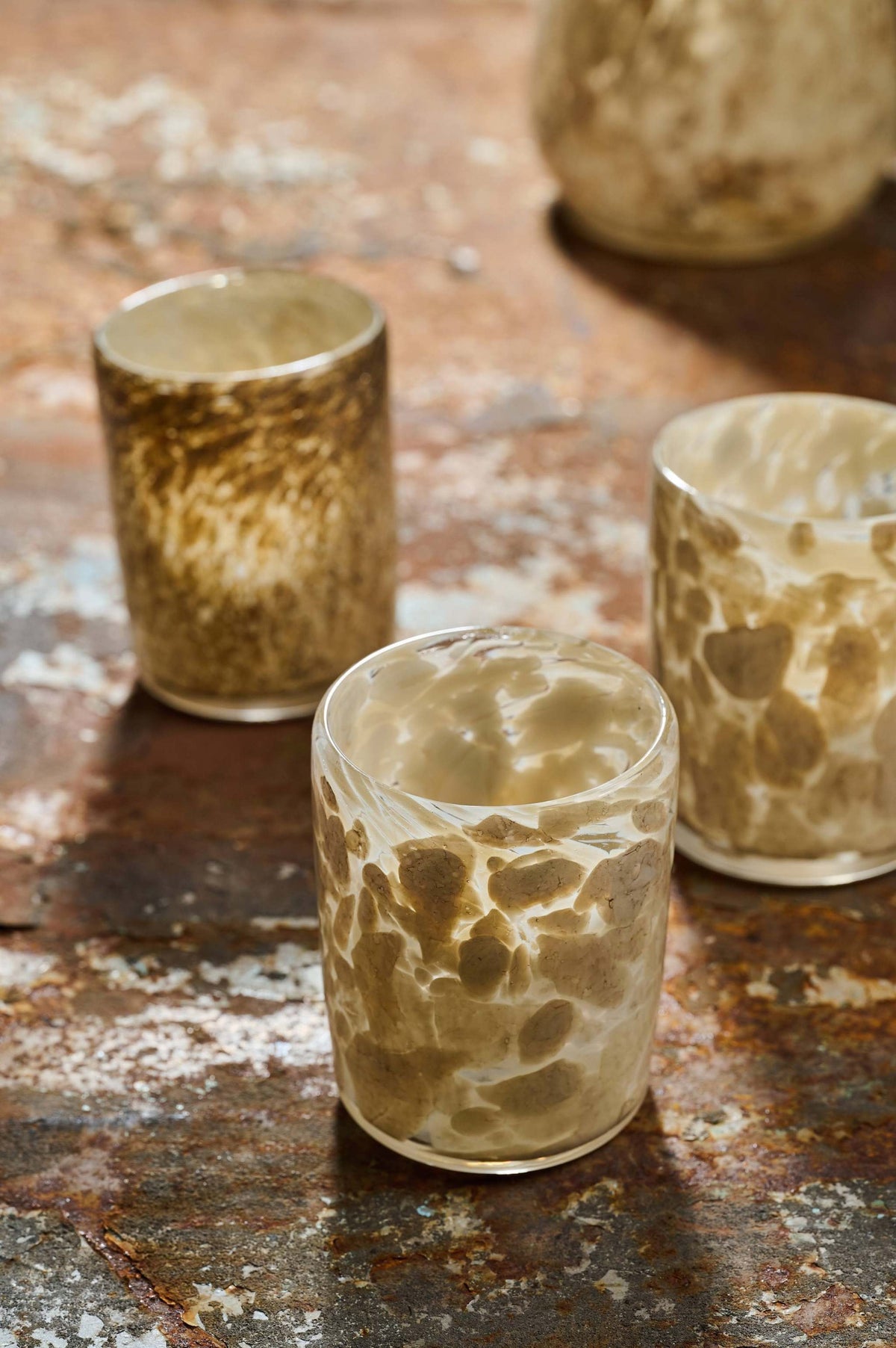 Hand blown glass tumbler with unique marble-inspired pattern and straight edges, handcrafted in Ukraine