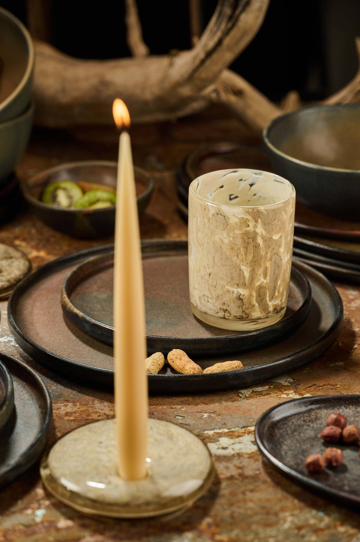 Hand blown glass candle holder with marble design and rounded shape