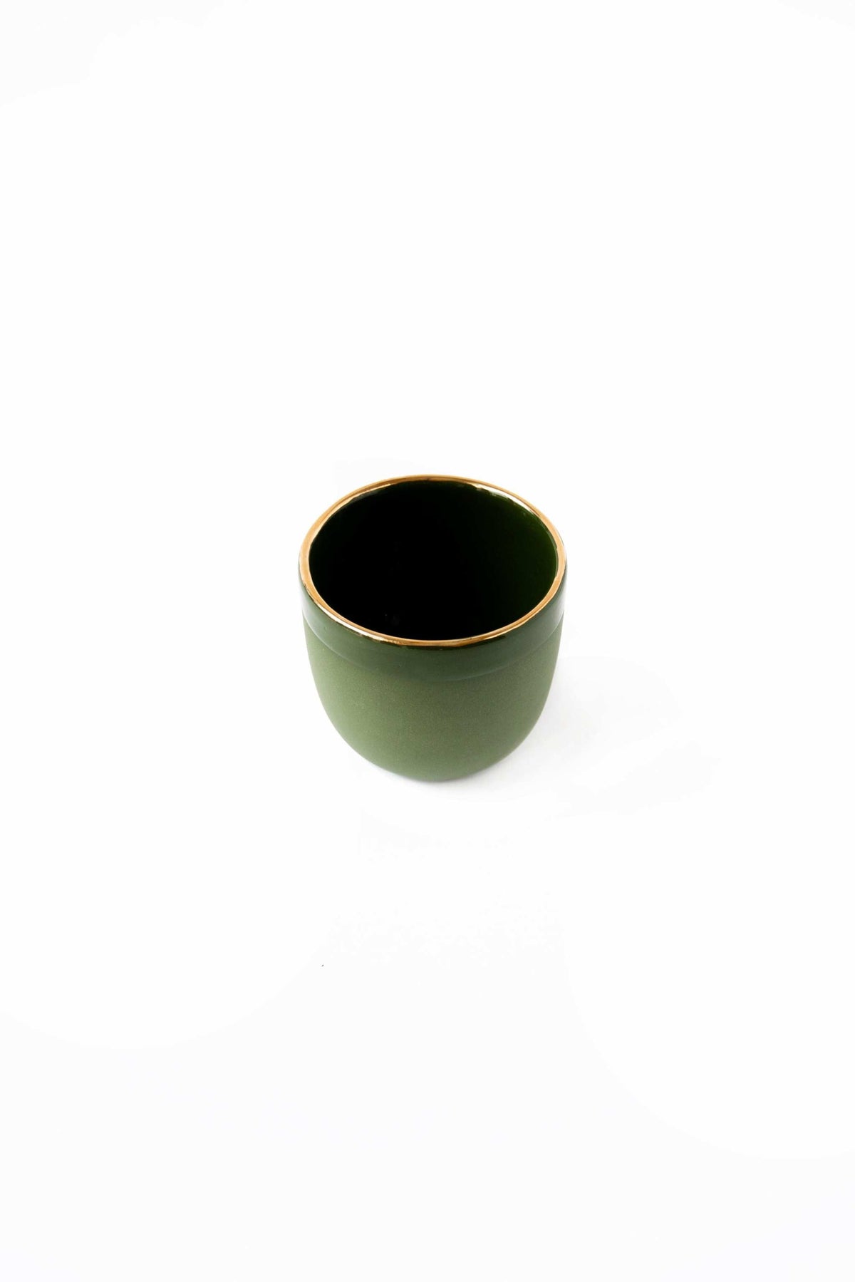 Handmade porcelain espresso cup with green exterior and gold rim