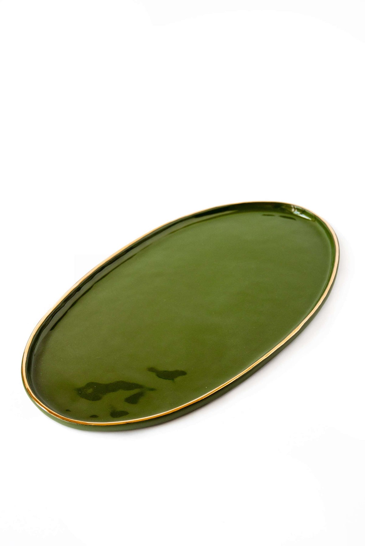 Handmade green porcelain oval serving platter with gold rim, organic edges, and food-safe glaze