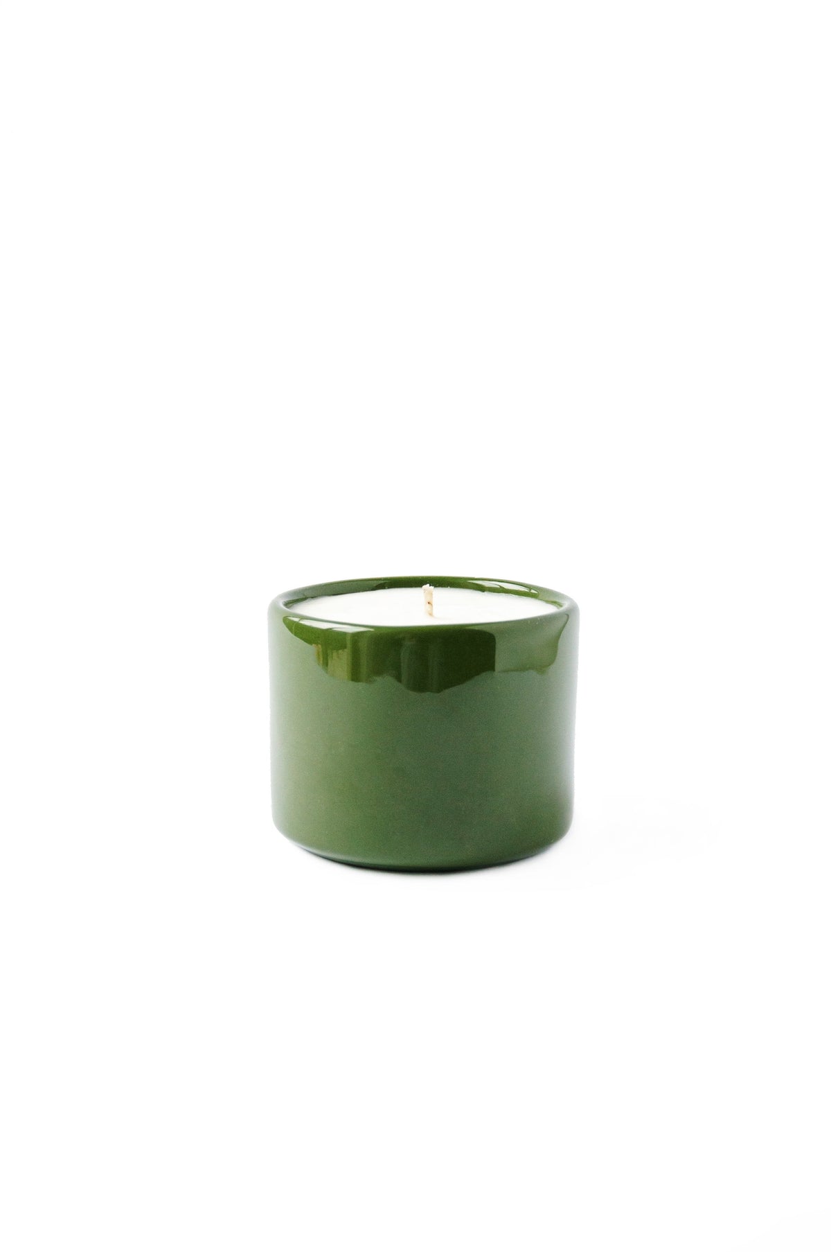 Handmade green porcelain candle bowl with organic soy wax, refillable and eco-friendly design