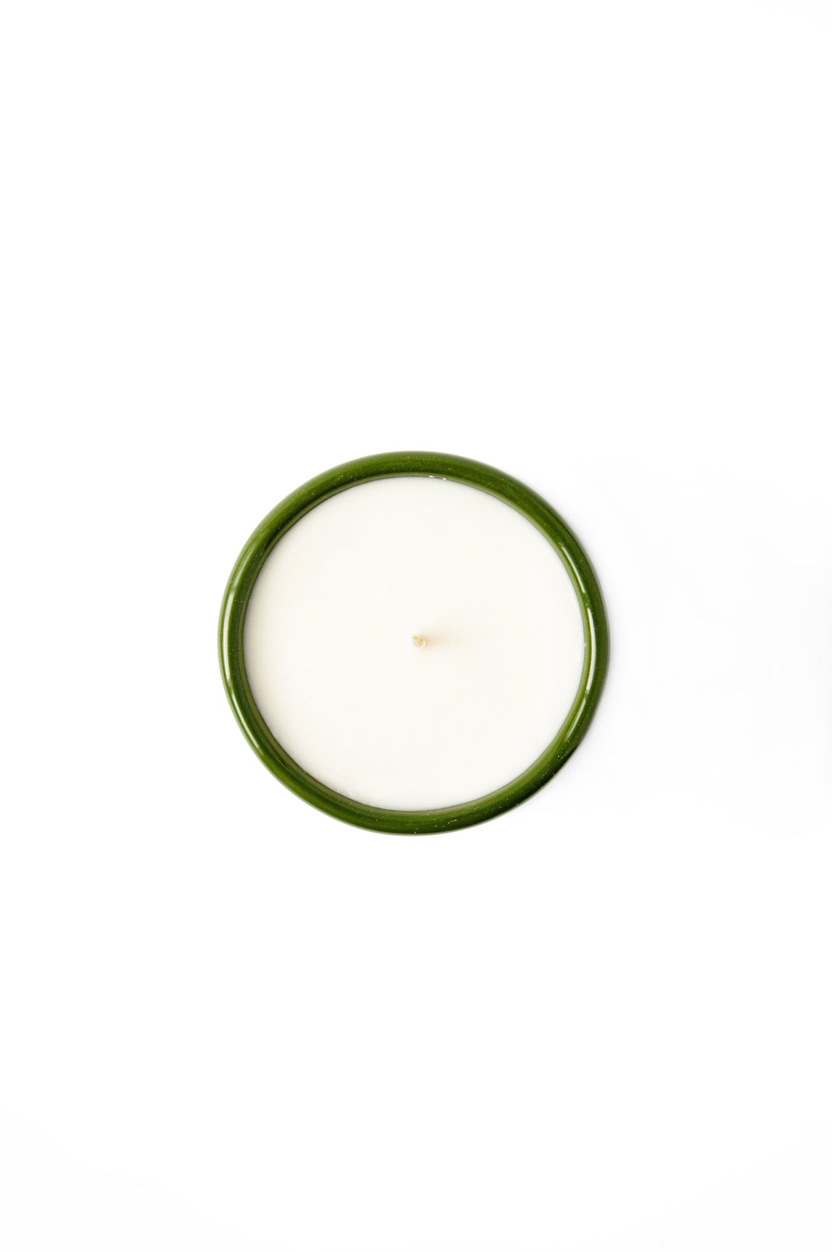 Handmade green porcelain candle filled with organic soy wax in refillable bowl