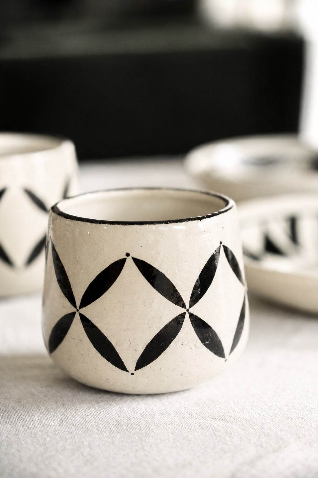 Hand painted coffee mug with traditional Hutsul geometric and four-leaf patterns from the Heritage Collection