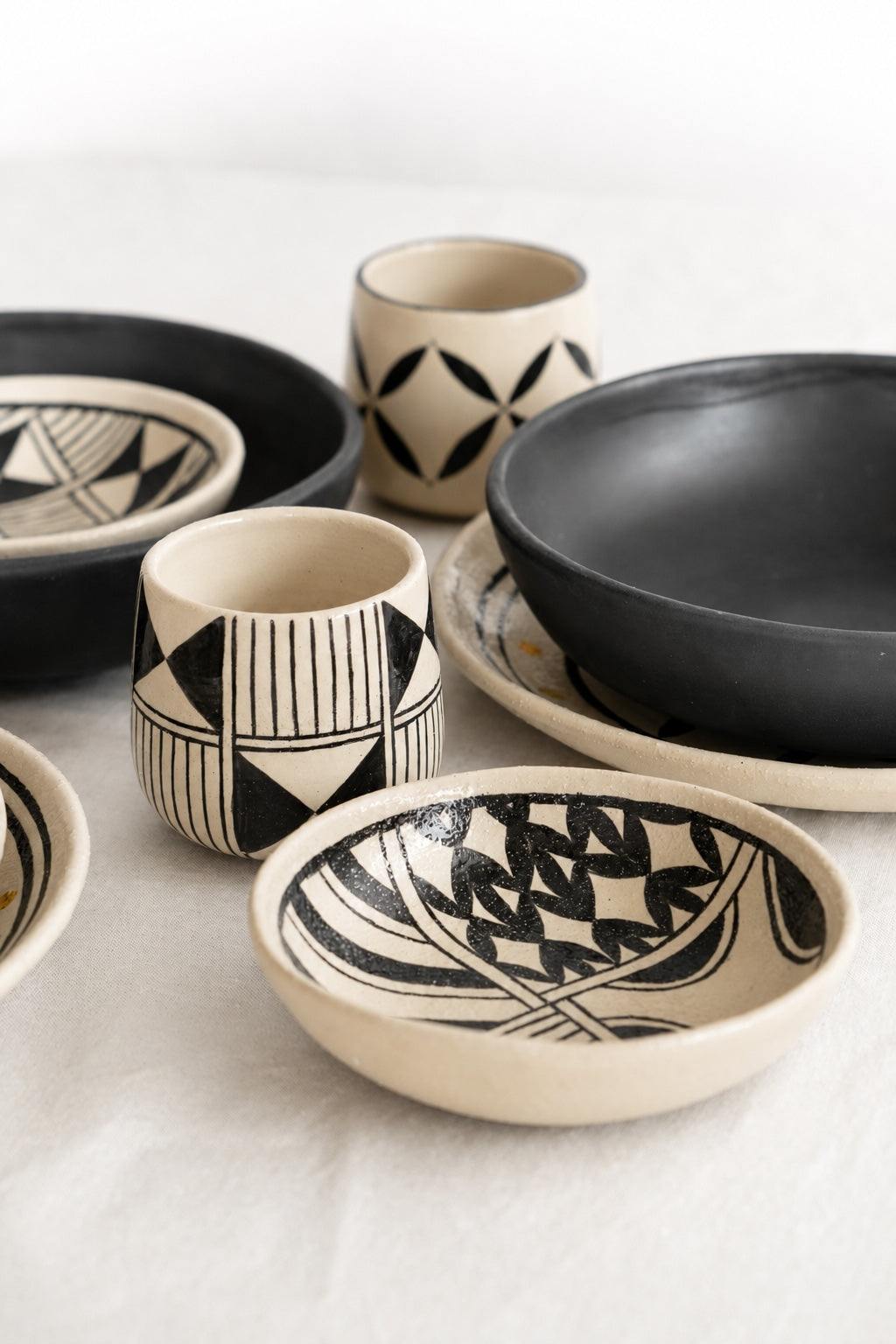 Hand painted stoneware salad plate from Ukrainian Heritage Collection with traditional Hutsul motifs and glossy glazed interior