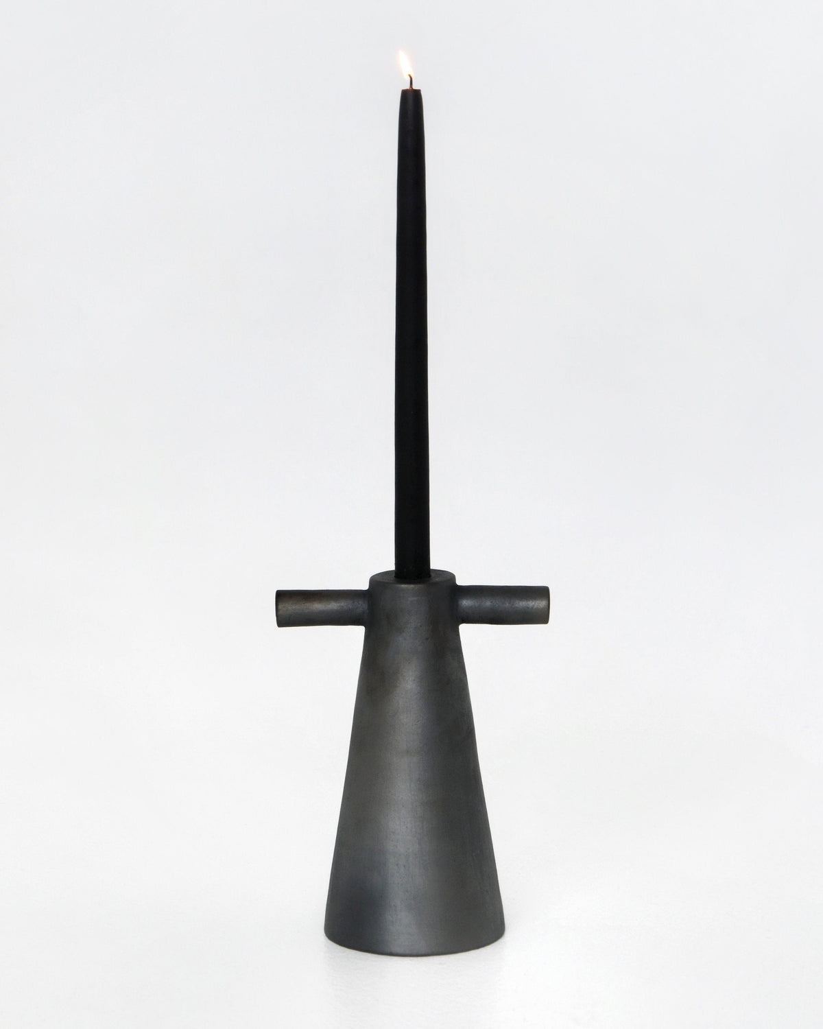Black stoneware tall candle holder handmade in Ukraine with modern design and cultural significance
