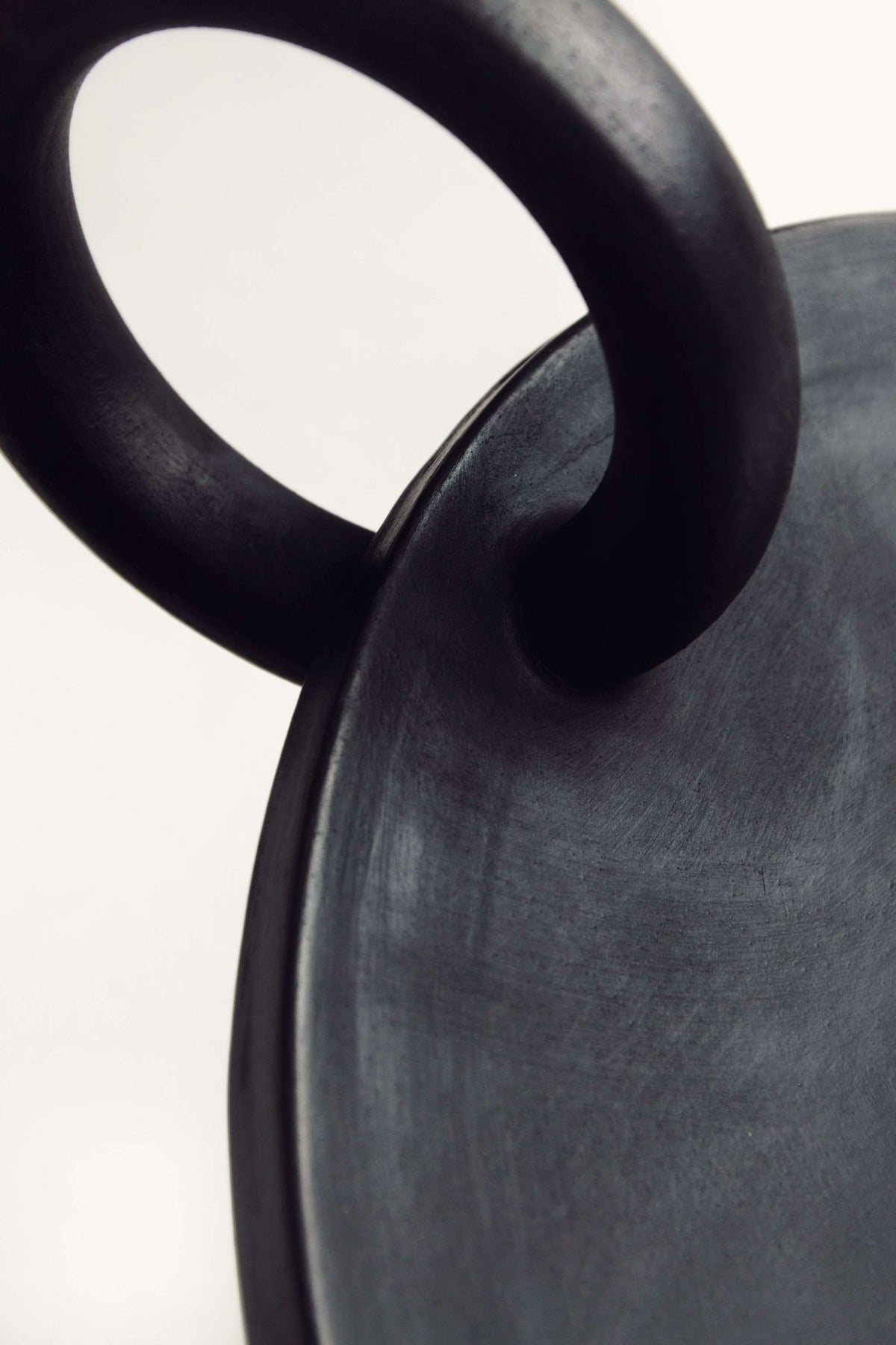 Large serving platter Guculiya Trinity handcrafted in Ukraine with black smoke-fired ceramic and unique textured edges