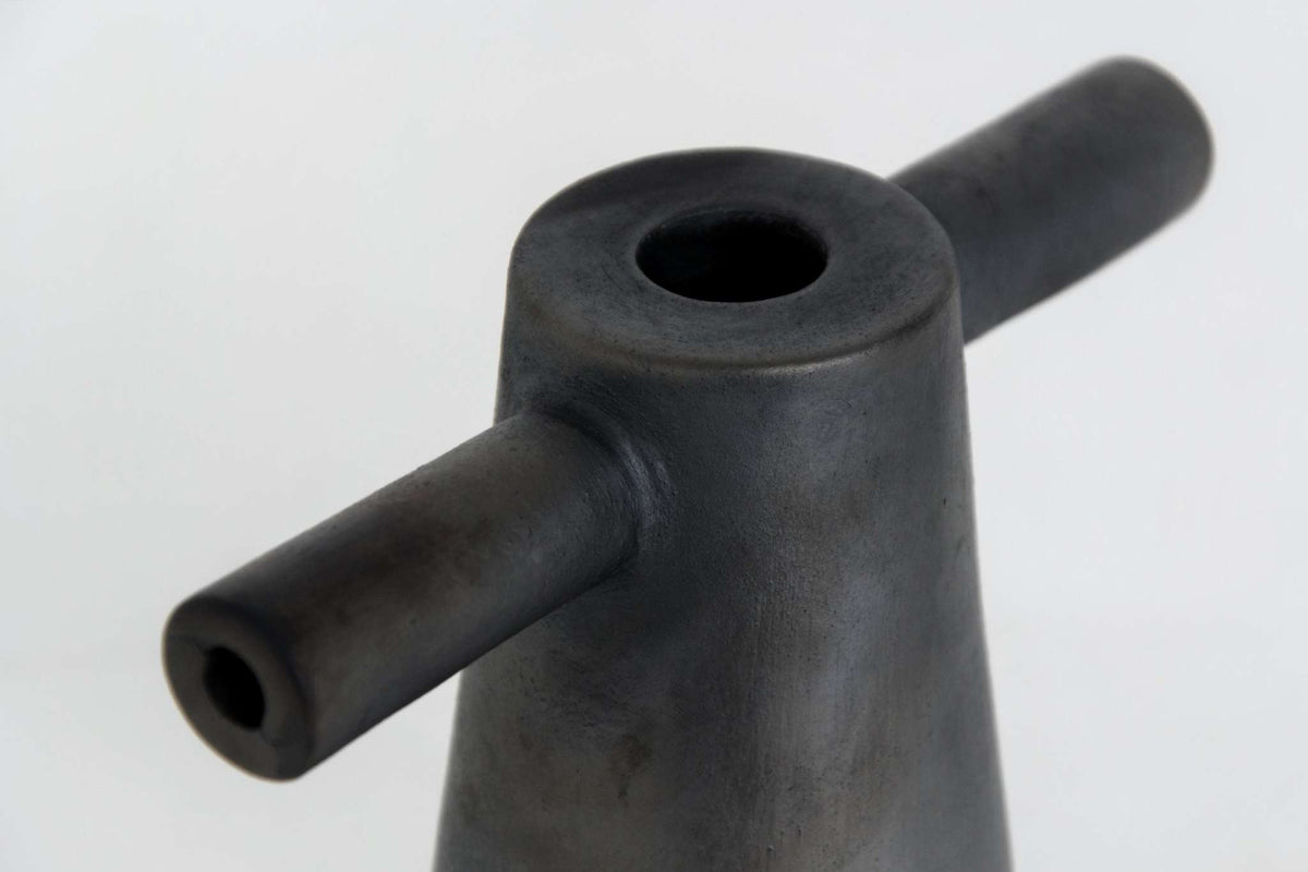 Black stoneware tall candle holder handmade in Ukraine with modern design and cultural significance