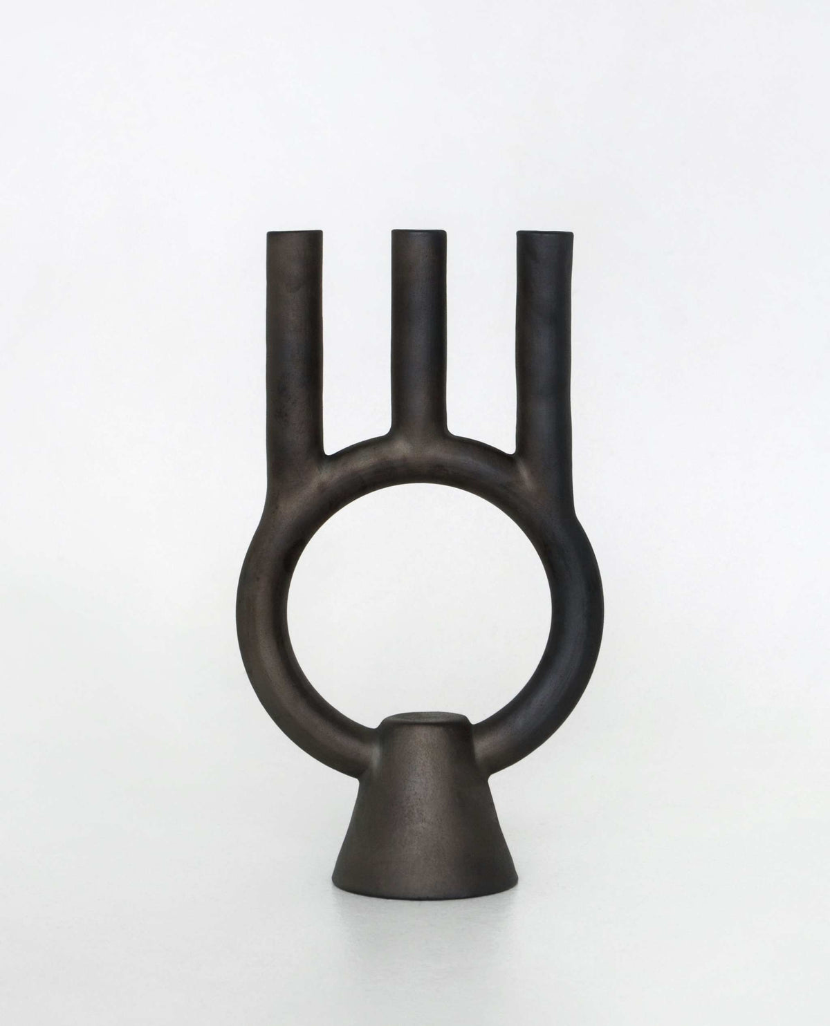 Smoke-fired ceramic black candle holder with modern handmade design by Danuta Kril