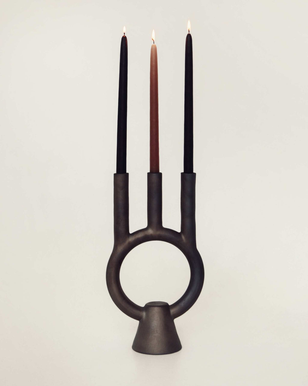 Smoke-fired ceramic black candle holder with modern design and deep cultural meaning handcrafted in Ukraine