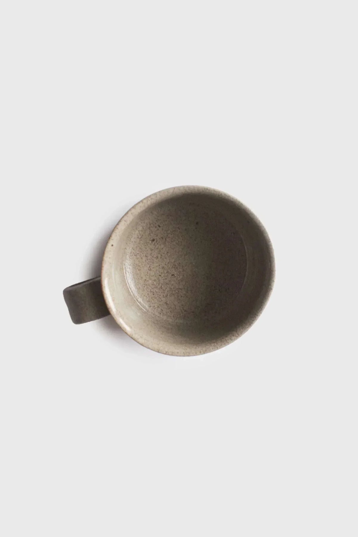 Handmade Stoneware Coffee Mug in mottled taupe glaze, with a wide open bowl shape and sturdy rectangular handle.