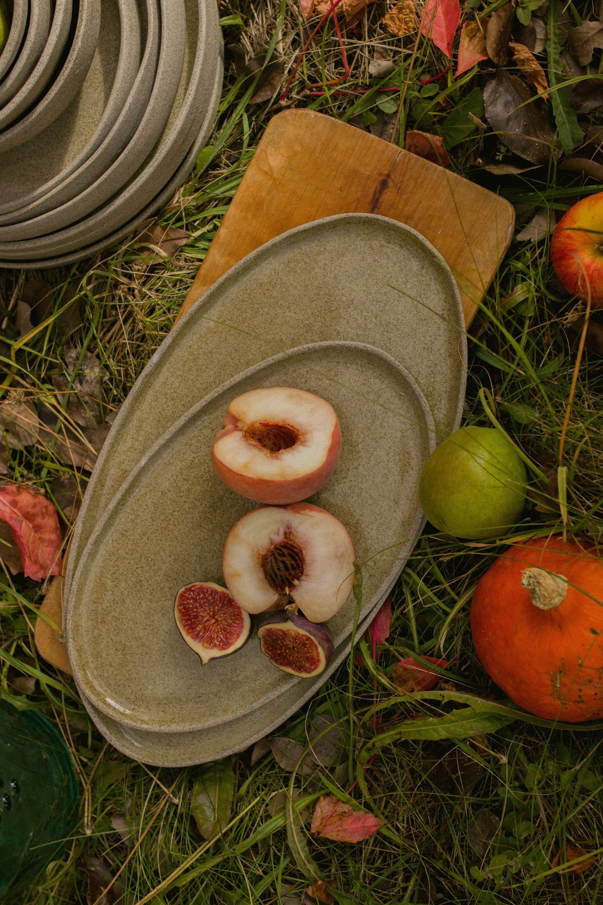 Handmade Stoneware serving platter in speckled gray-beige with a glossy glaze and softly raised oval rim.