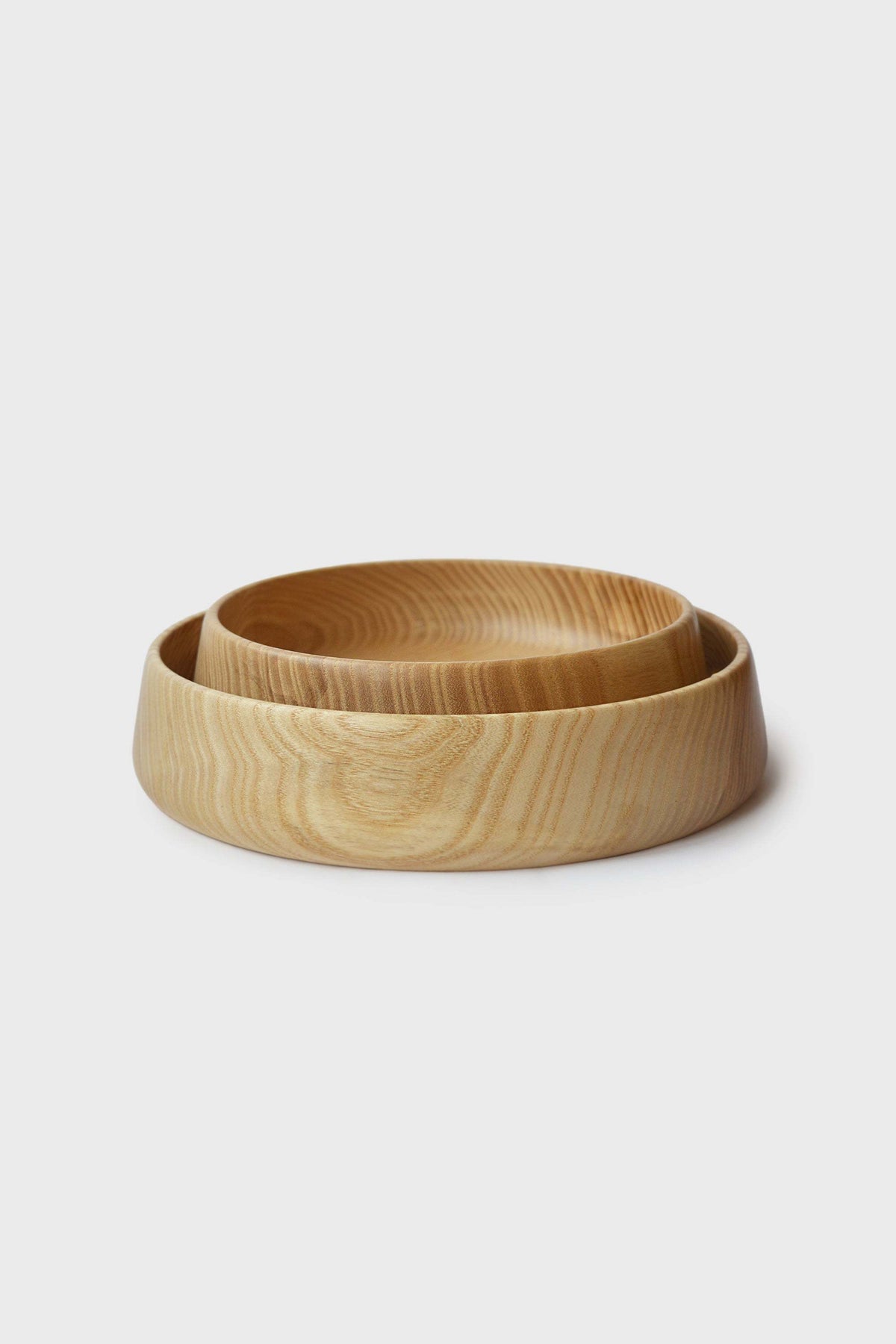 Hand Carved Wooden Plate in natural honey-brown wood with visible swirling grain and a deep rounded rim.