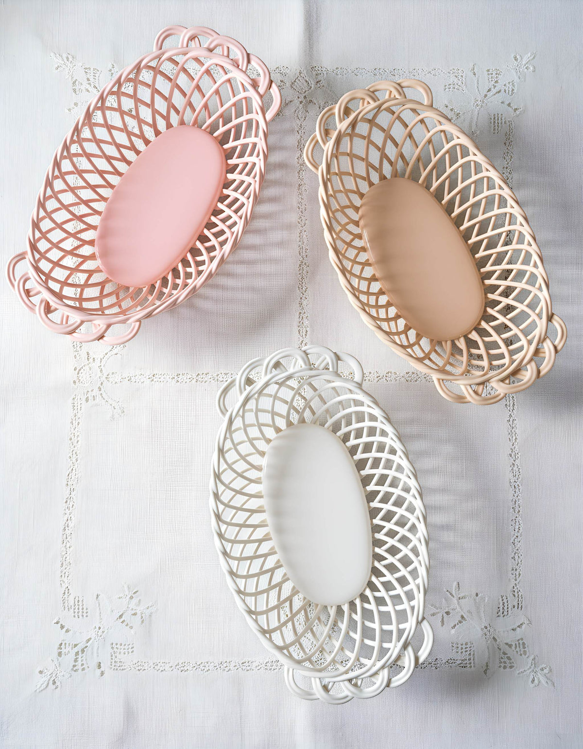 Ceramic Oval Basket in pink, beige, and white glazed porcelain, with woven lattice sides and smooth oval centers.