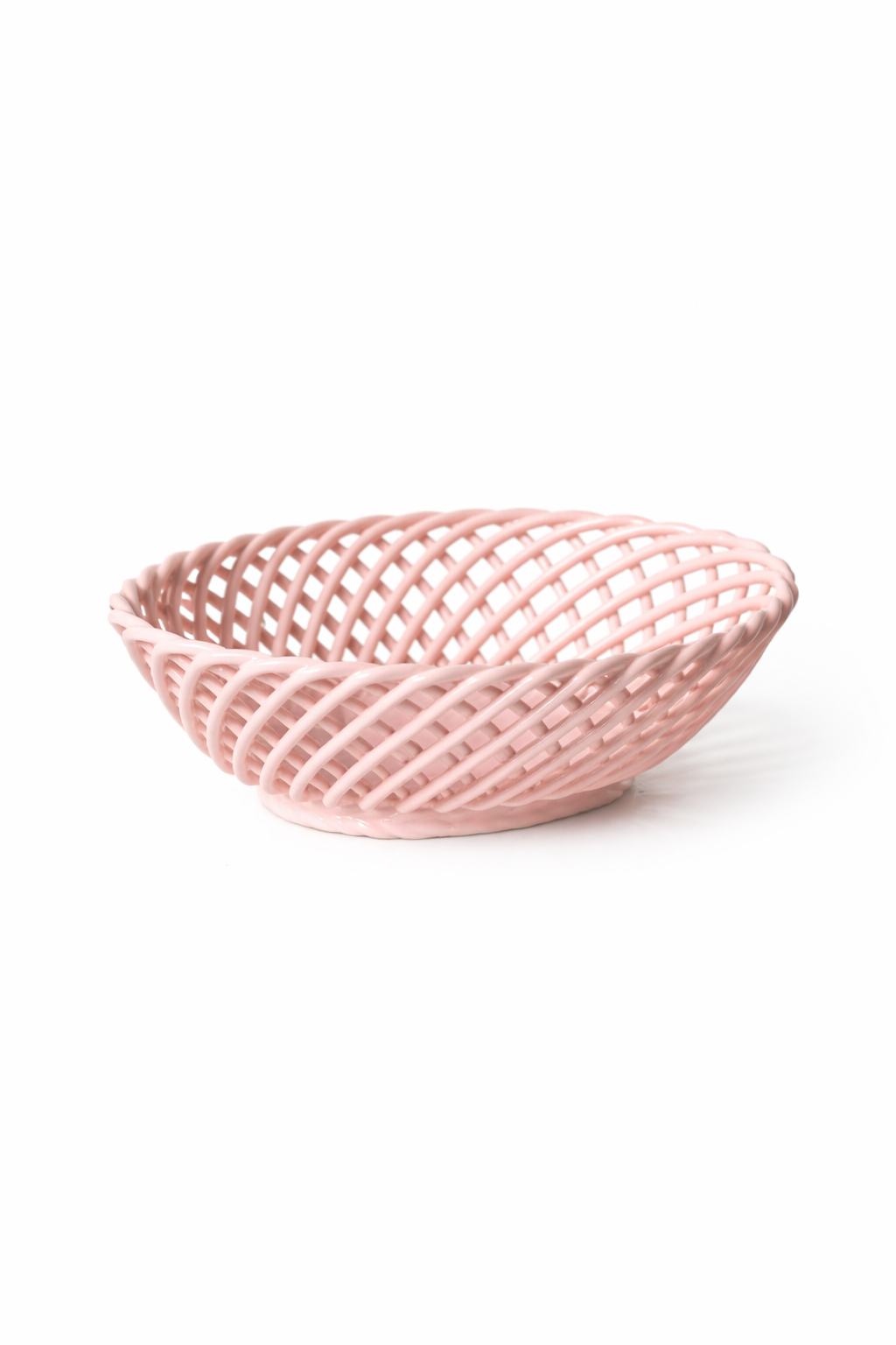 Hand-Woven Ceramic Basket in soft pink glazed porcelain, with an airy oval shape and interlaced open-weave design.