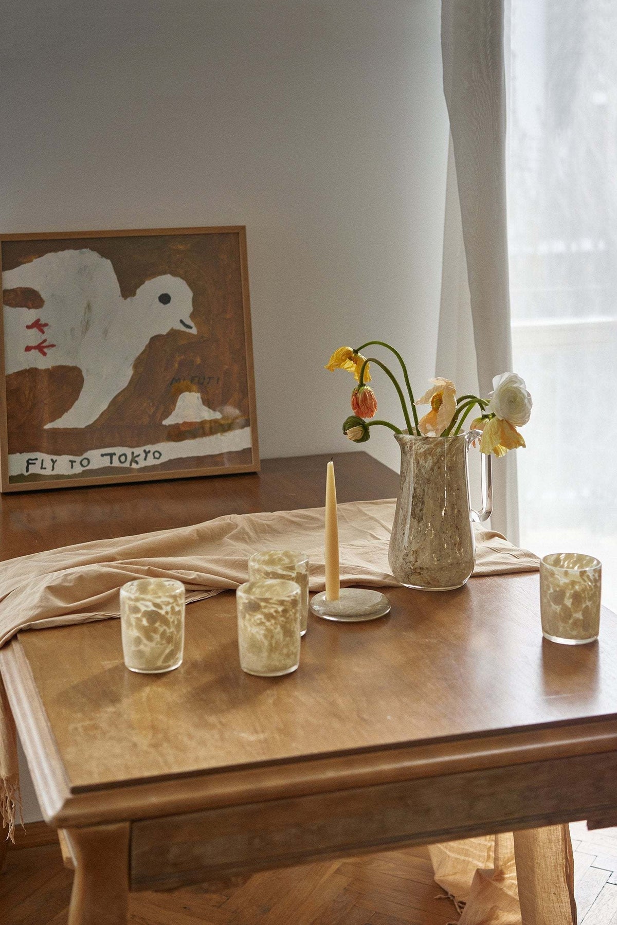 Hand blown glass candle holder with marble-inspired rounded shape and unique imperfections, made in Ukraine