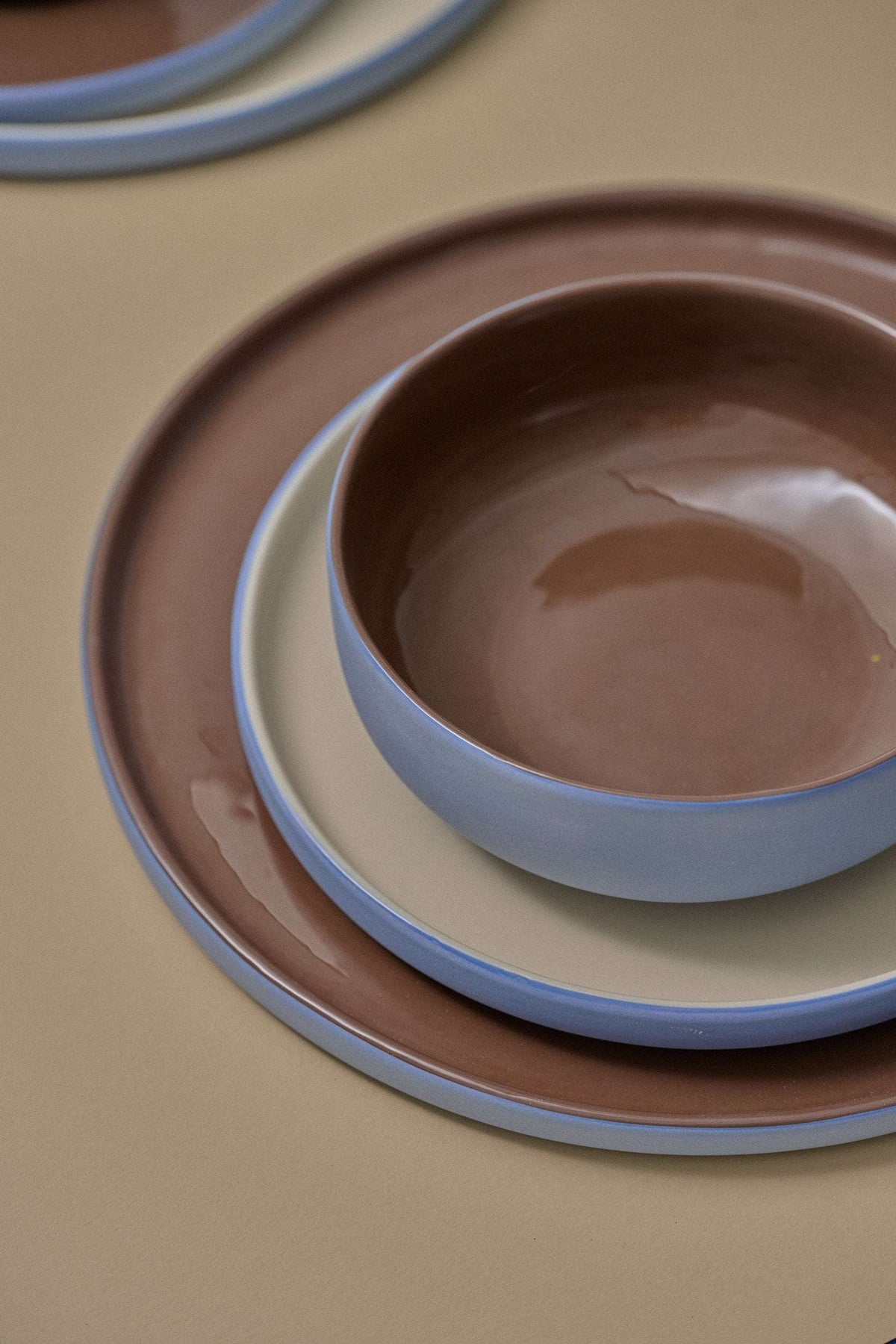 Handmade porcelain bowl with forget-me-not exterior and chocolate interior glaze