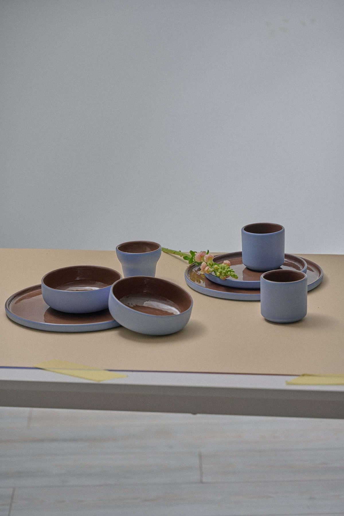 Handmade porcelain pear-shaped coffee cup with forget-me-not exterior and chocolate interior glaze