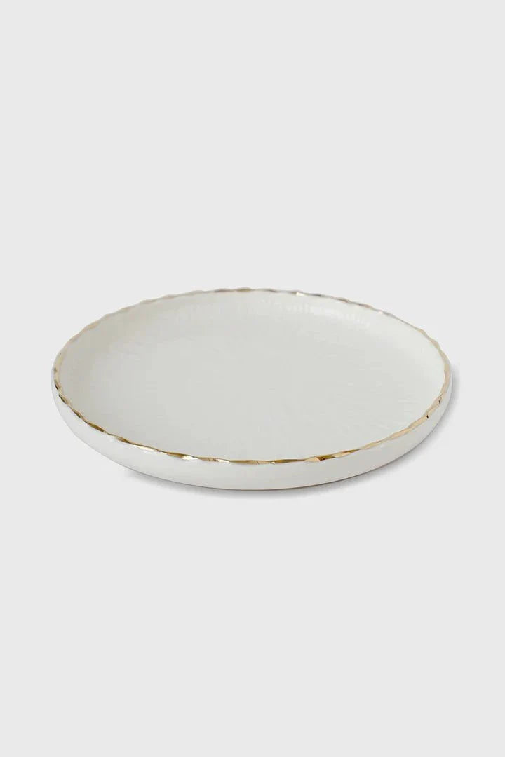 Handmade porcelain dinner plates with off-white relief texture and gold rim from Relief Collection
