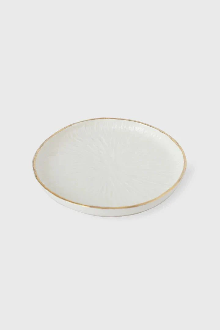 Handmade porcelain dinner plates with off-white relief texture and gold rim from Relief Collection