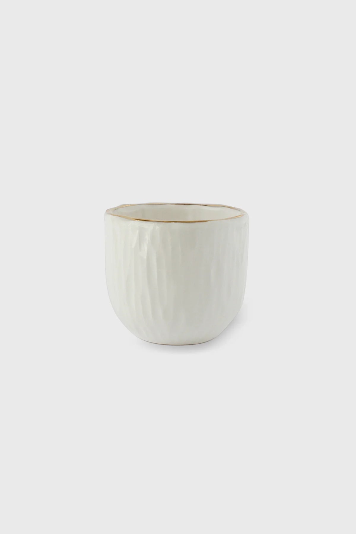 Handmade white porcelain espresso cup with hand-carved relief and gold rim from Off-White Porcelain Collection