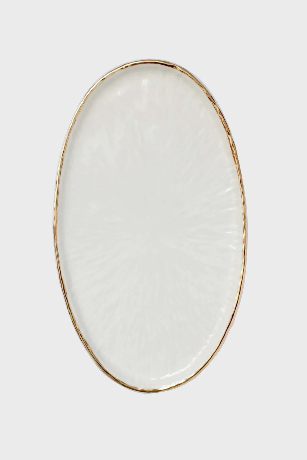 Oval serving platter in off-white Handmade Porcelain with subtle textured relief and a thin hand-painted gold rim