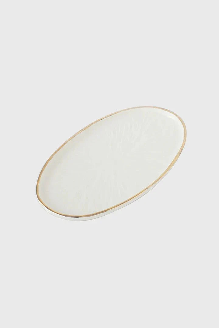 Serving platter in Handmade Porcelain, off-white with a subtle carved relief texture and delicate gold rim, oval shape.
