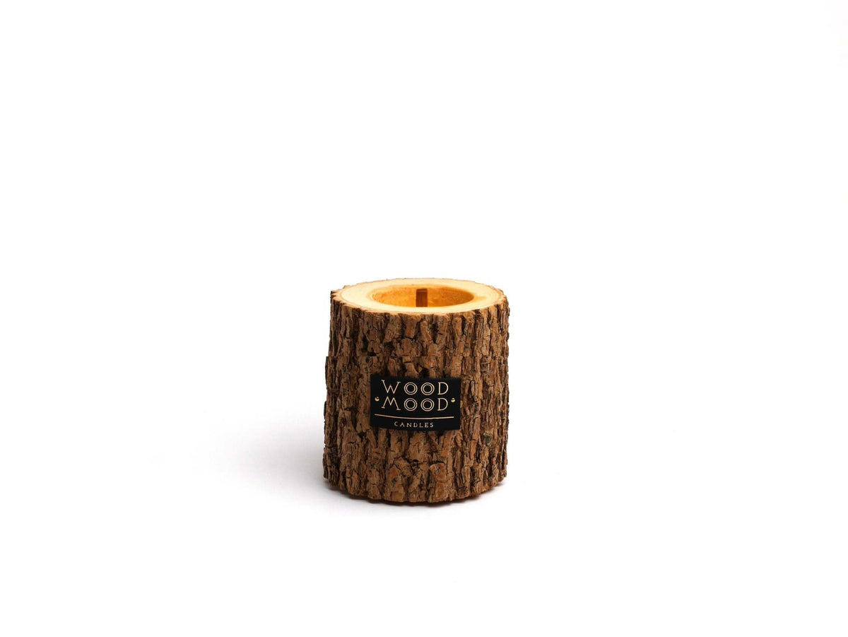 Rocky Wood Candle with multi-layer wick and Winter Spruce scent on wooden surface