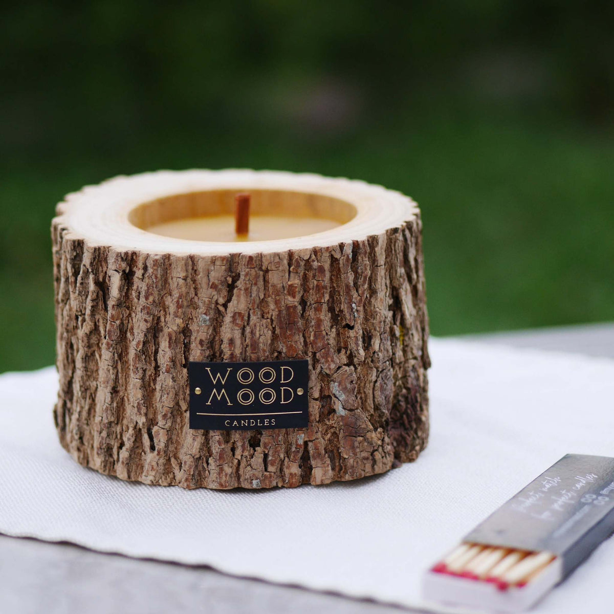 Rocky Wood Candle with multi-layer wick and winter spruce scent on cork base