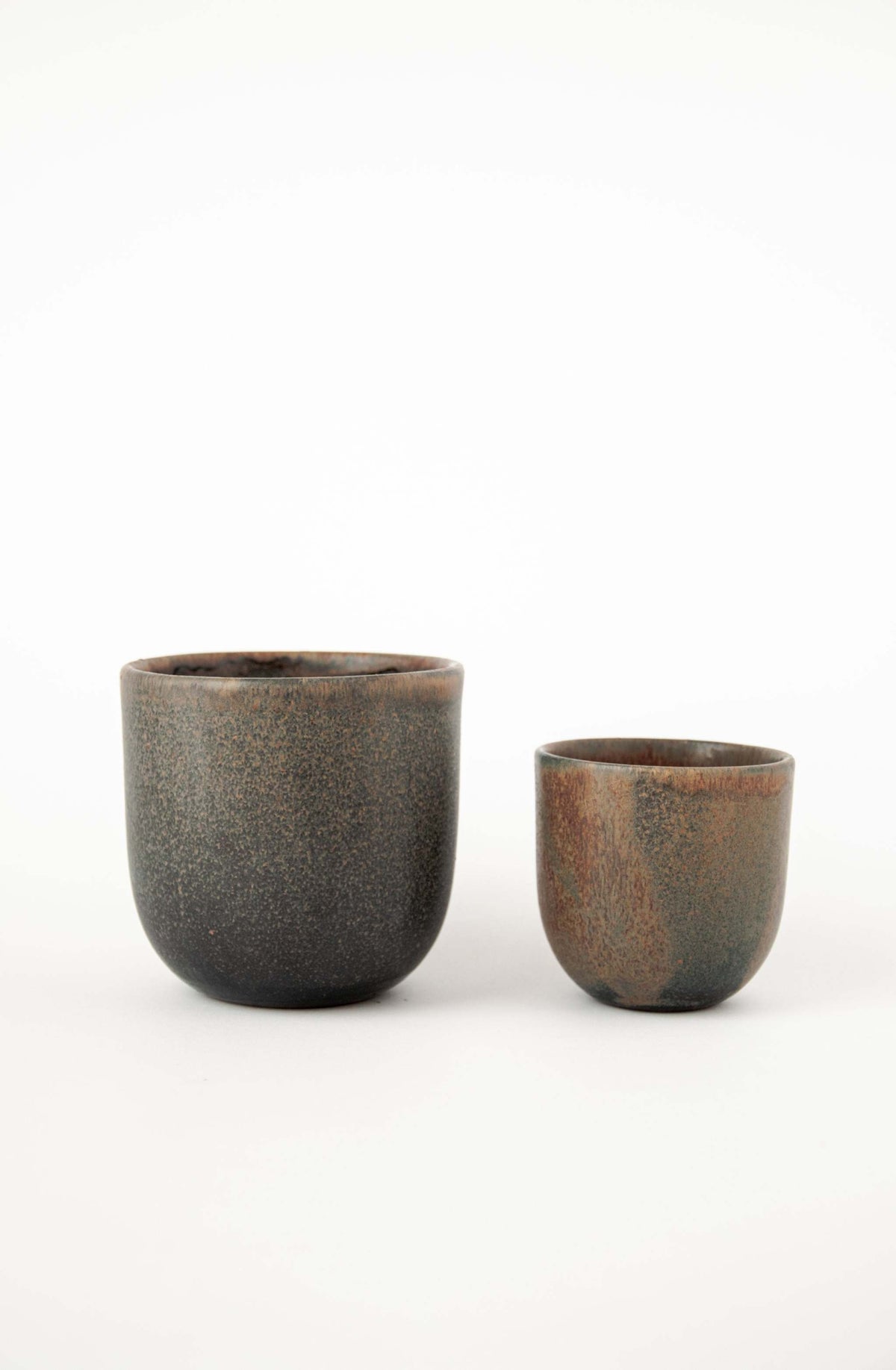 Rust stoneware coffee cup with organic edges and reactive glaze, handmade in Ukraine, 11 oz, dishwasher and microwave safe