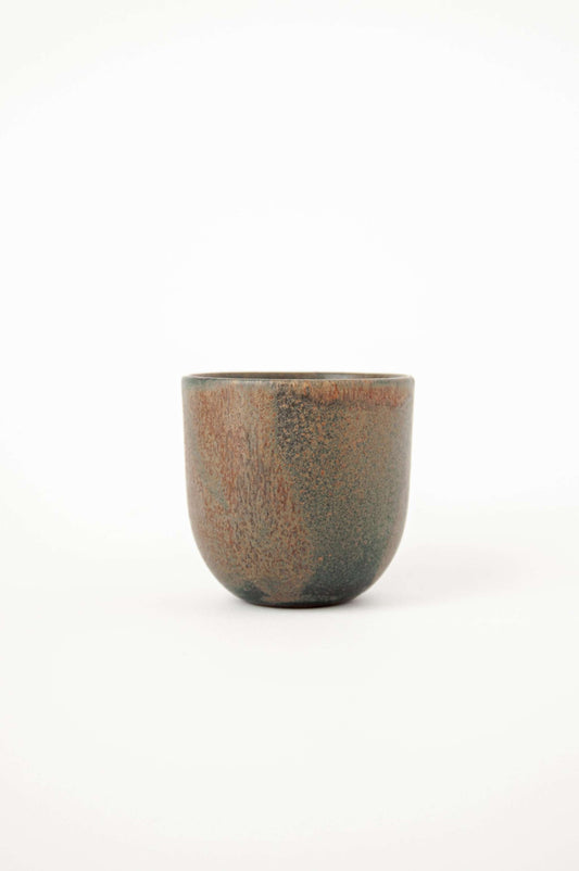 Rust stoneware espresso coffee cup with organic edges and reactive glaze swirl, handmade in Ukraine