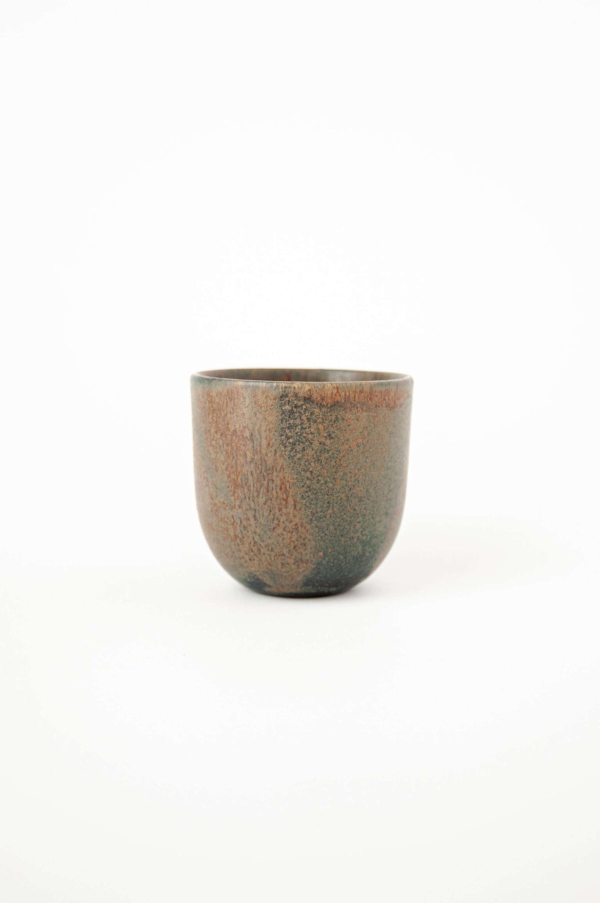 Rust stoneware espresso coffee cup with organic edges and reactive glaze, handmade in Ukraine
