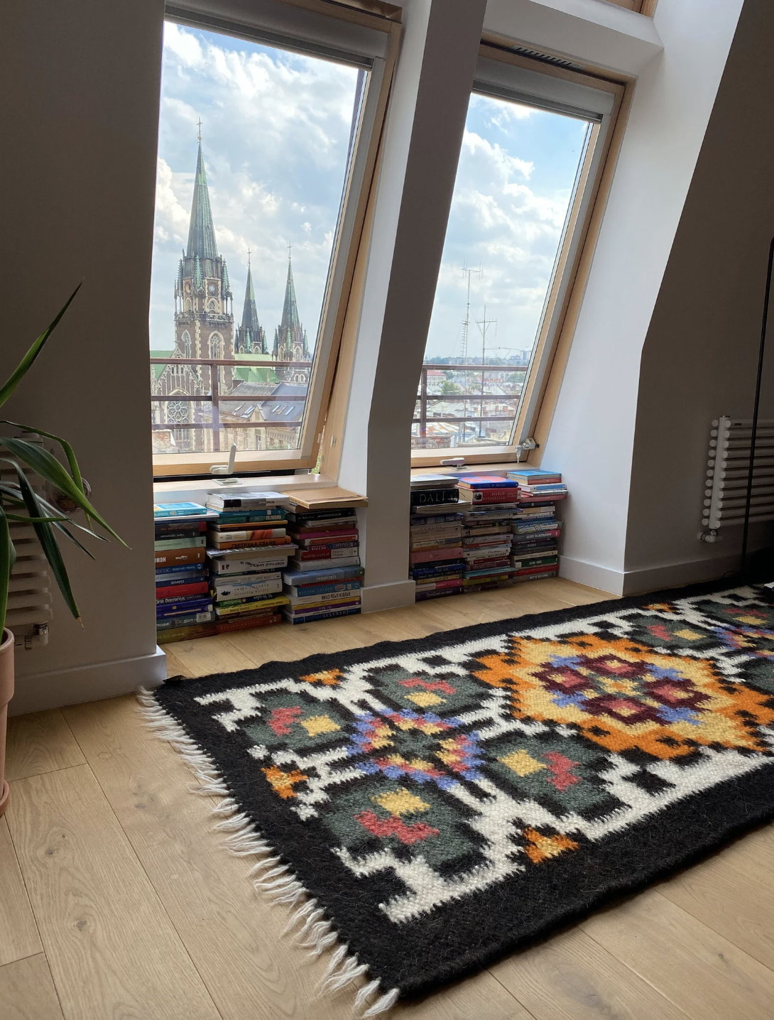 Handwoven wool runner with traditional Carpathian embroidery pattern on natural wool rug
