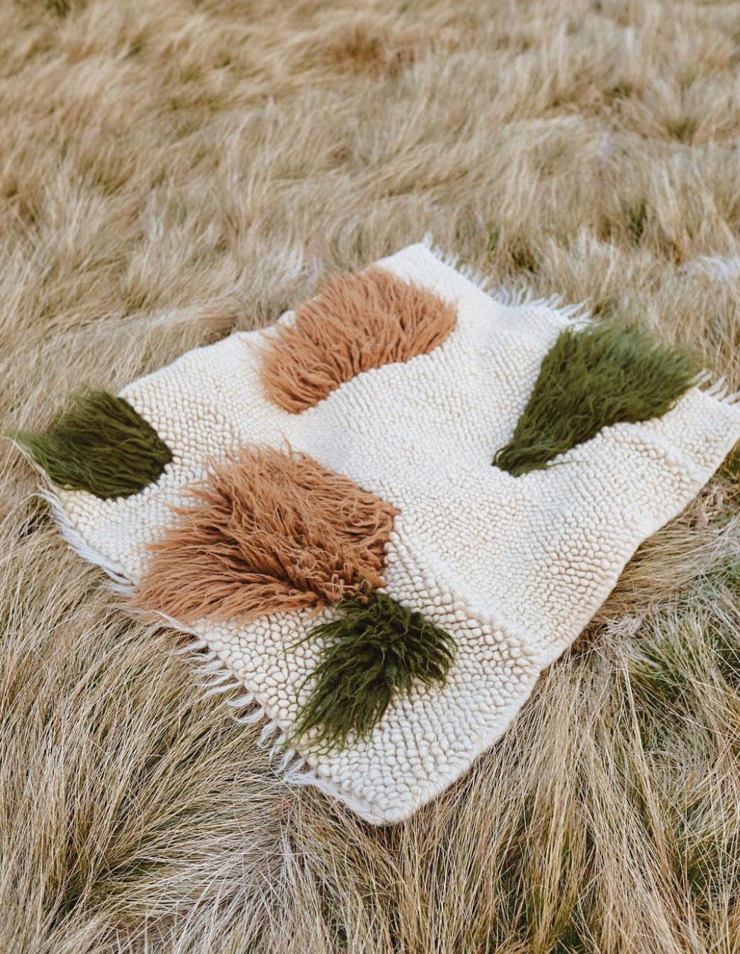 Handwoven rug "Forest" made of natural sheep wool with earthy tones and traditional weaving technique