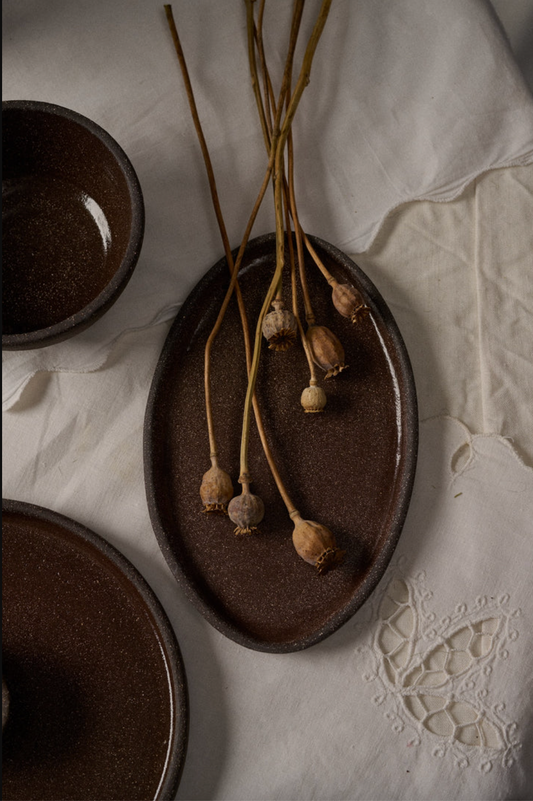 Oval Stoneware Serving Platter, dark brown with a speckled glazed surface and rustic raised rim; Stoneware Serving Platter for serving.