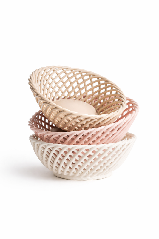 Hand-Woven Ceramic Basket set of three glossy porcelain oval dishes in beige, pink and white, with airy woven latticework.