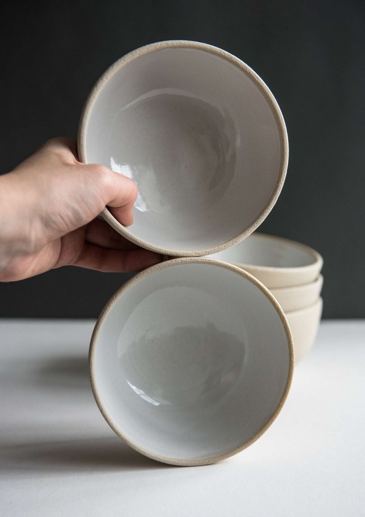 Handmade stoneware small bowl with textured exterior and smooth white glaze, dishwasher safe and food-safe, crafted in Ukraine